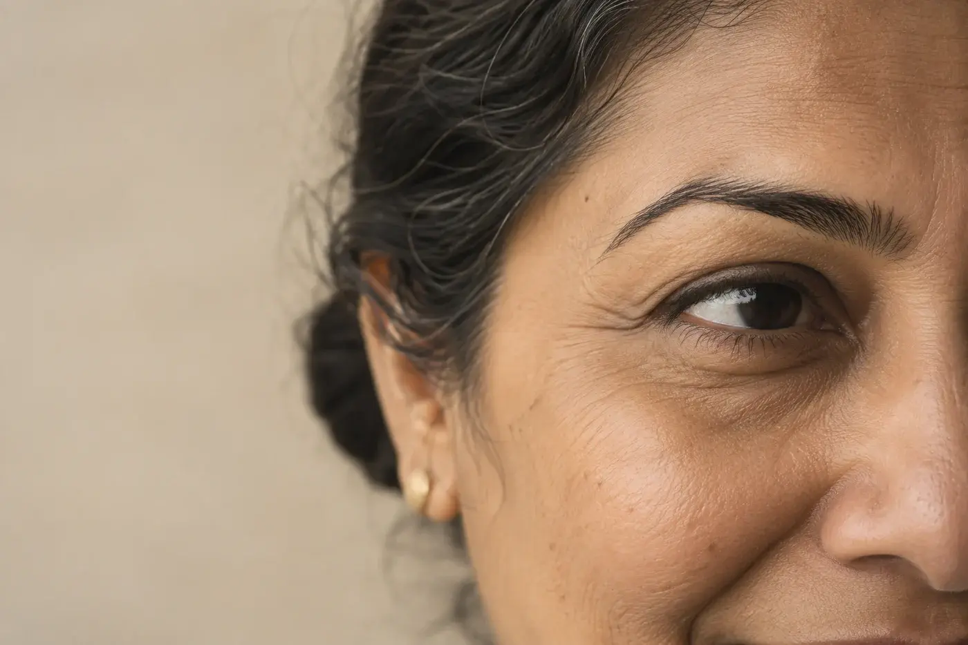 Illustrative close-up of natural lines around an eye and brow